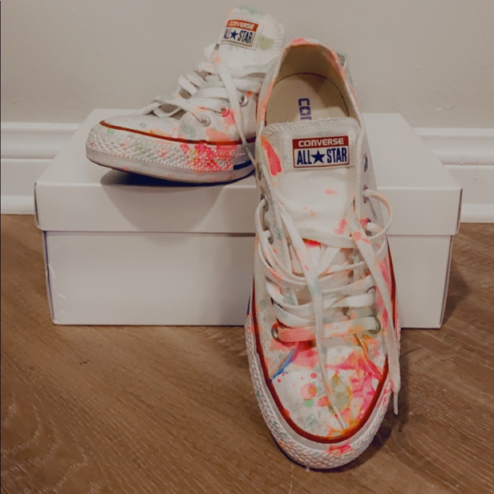 White Converse with neon paint splatter.